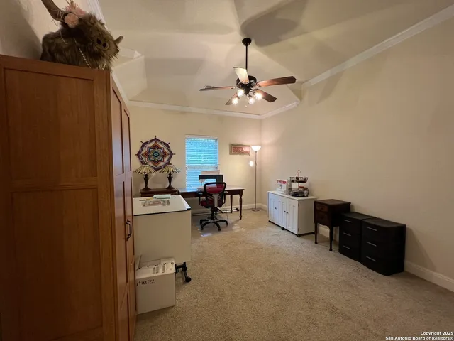 a bedroom with a bed couch and a fireplace
