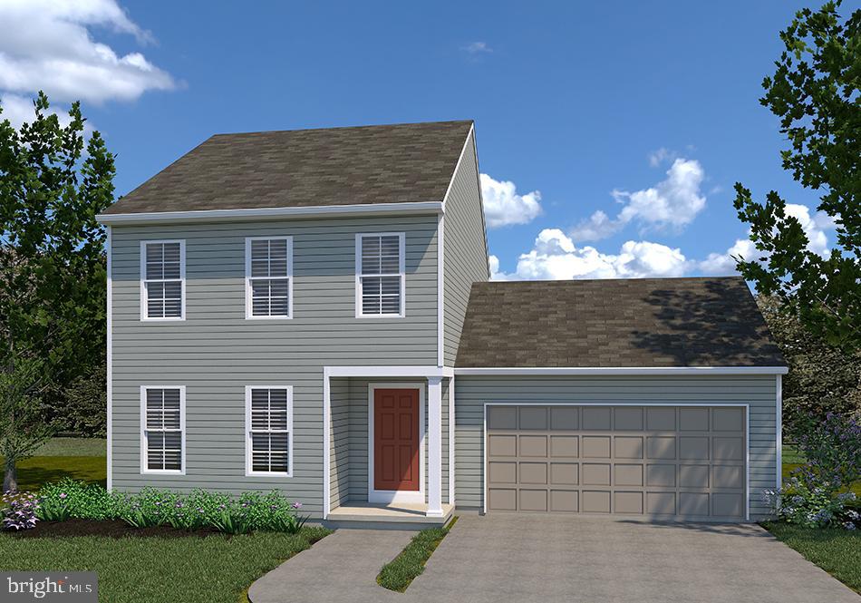 Hartman Model At Eagles View York, PA 17406 - Photo 2 of 4 a front view of a house with a yard and garage