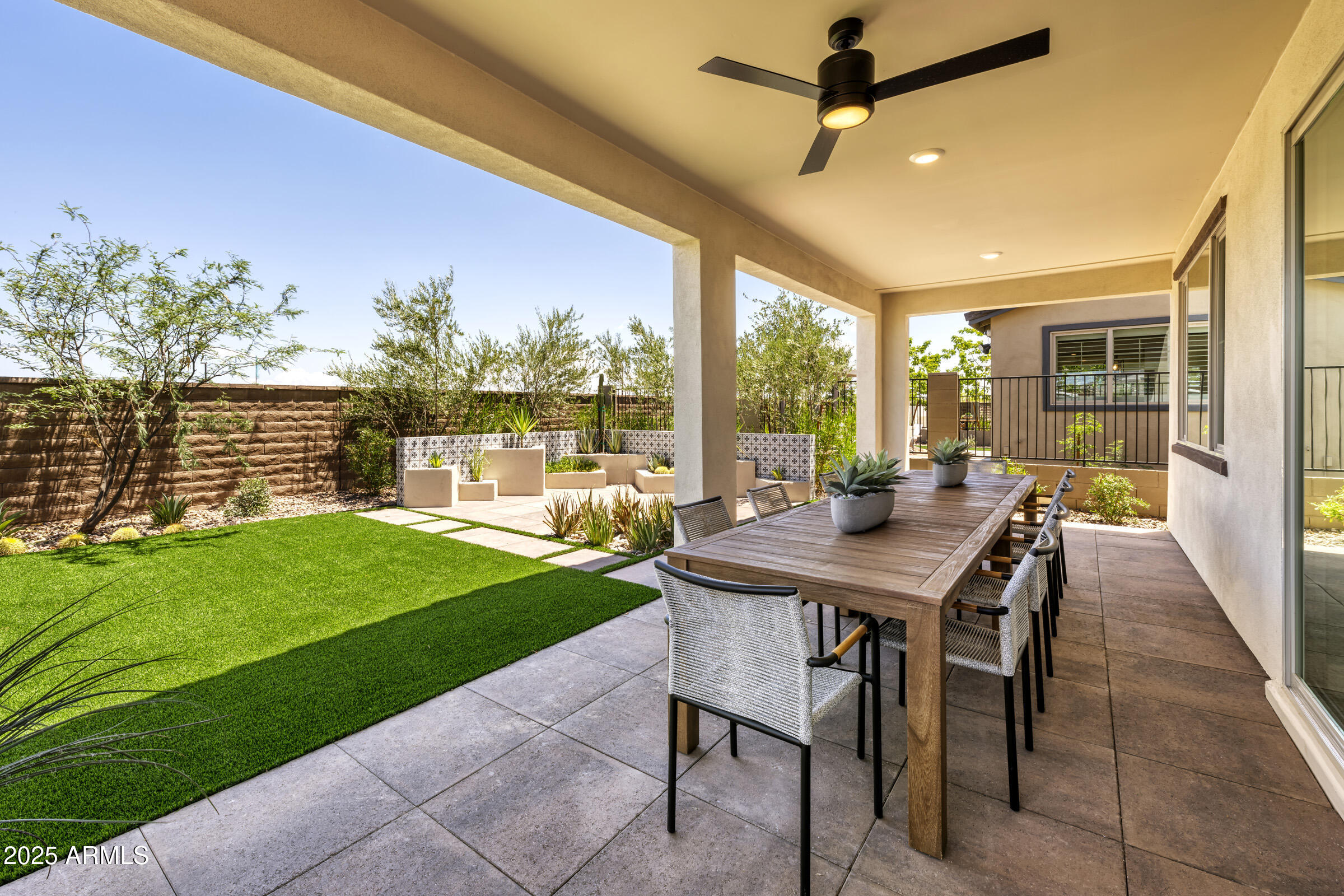 1506 East Coconino Way Gilbert, AZ 85298 - Photo 11 of 13 a view of a patio with a table chairs and a backyard