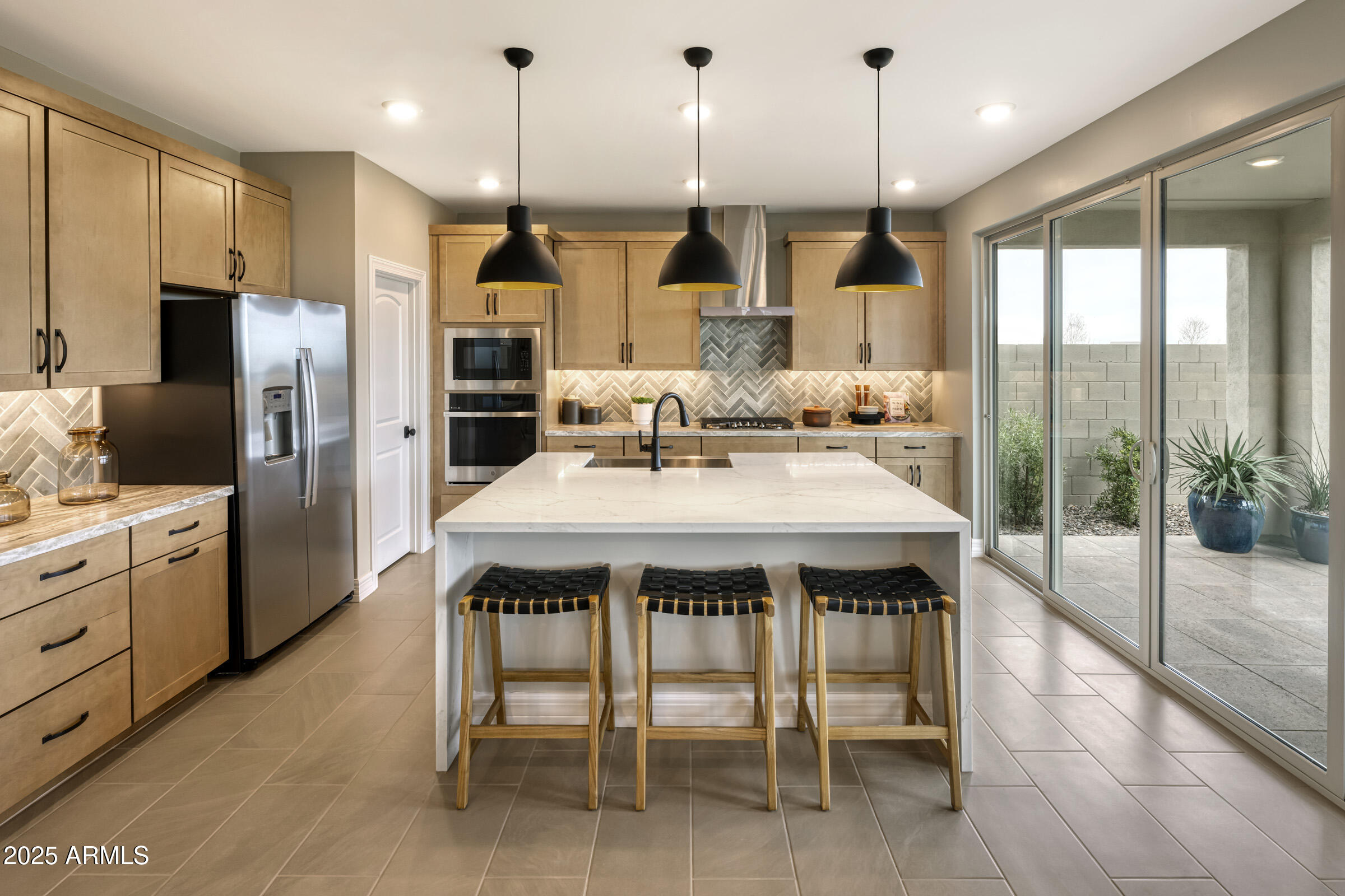 1506 East Coconino Way Gilbert, AZ 85298 - Photo 2 of 13 a kitchen with kitchen island a sink dining table and chairs