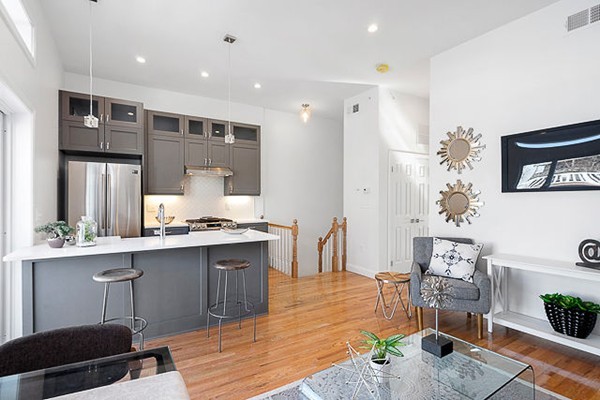 126 Princeton Street, Unit 3 Boston, MA 02128 - Photo 2 of 8 a large kitchen with cabinets table and chairs