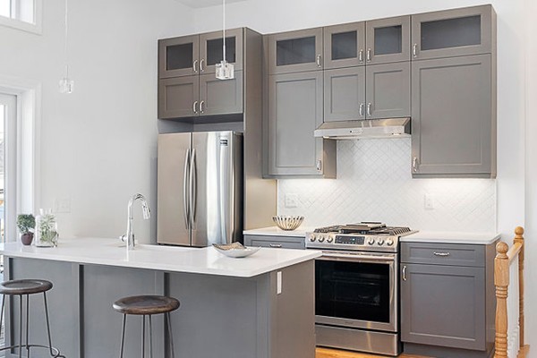 126 Princeton Street, Unit 3 Boston, MA 02128 - Photo 3 of 8 a kitchen with stainless steel appliances a stove and a refrigerator