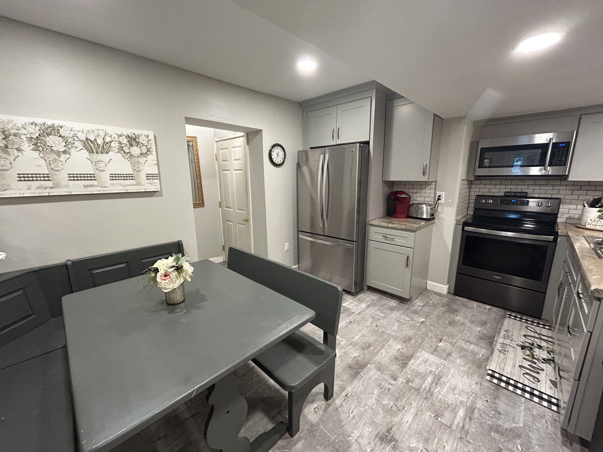 4020 Clovercroft Road Franklin, TN 37067 - Photo 45 of 63 a kitchen with stainless steel appliances granite countertop a refrigerator a stove a sink a dining table and chairs