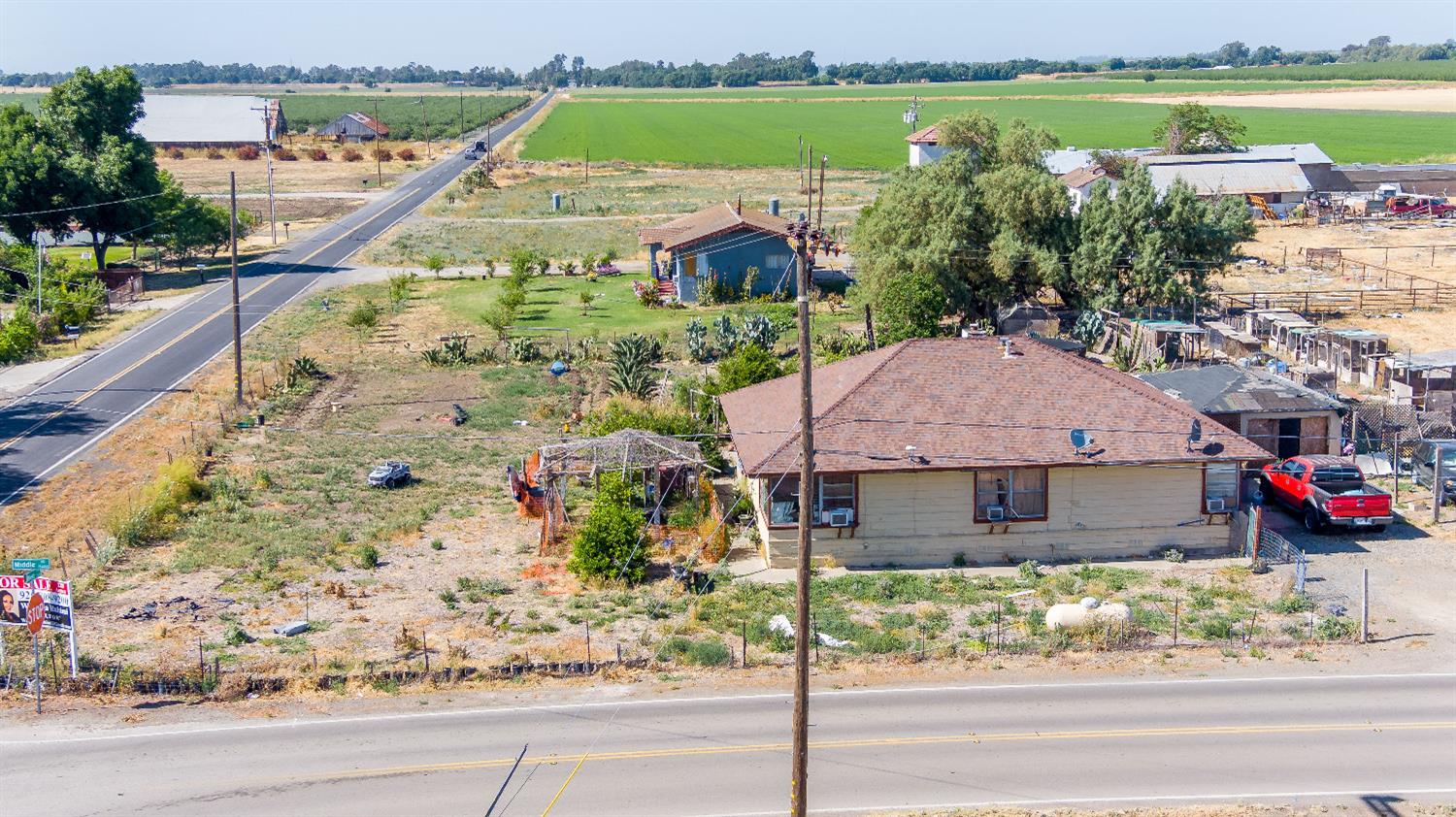 21070 South Reeve Road Tracy, CA 95304 - Photo 3 of 7 a view of a house with a yard and a large tree