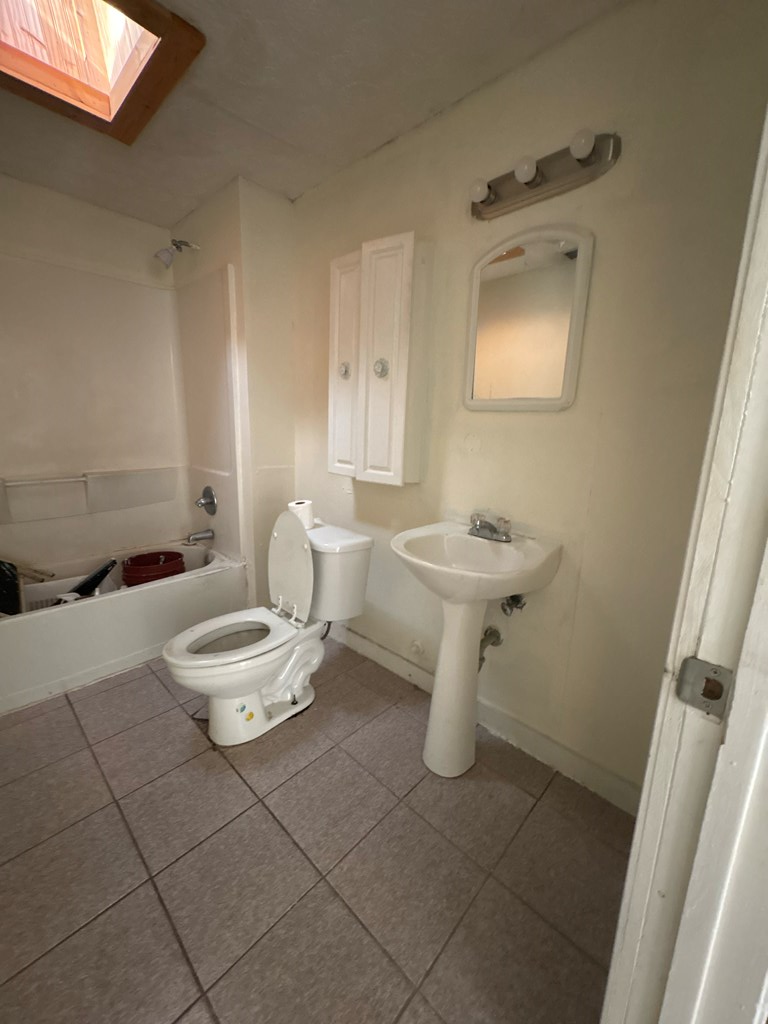 2910 Beech Street Columbus, GA 31909 - Photo 17 of 24 a bathroom with a sink toilet and a mirror