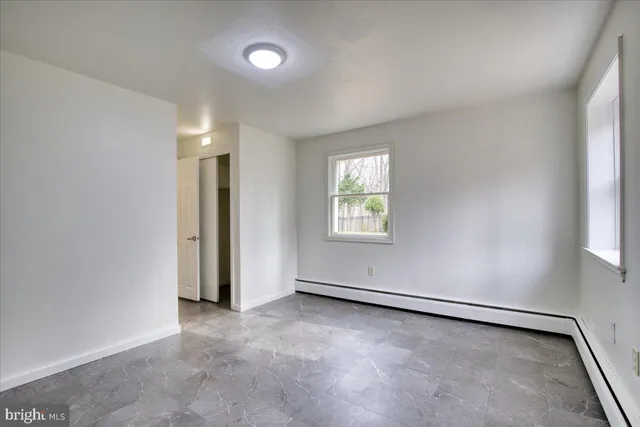 an empty room with windows