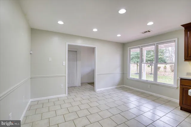 a view of an empty room and window