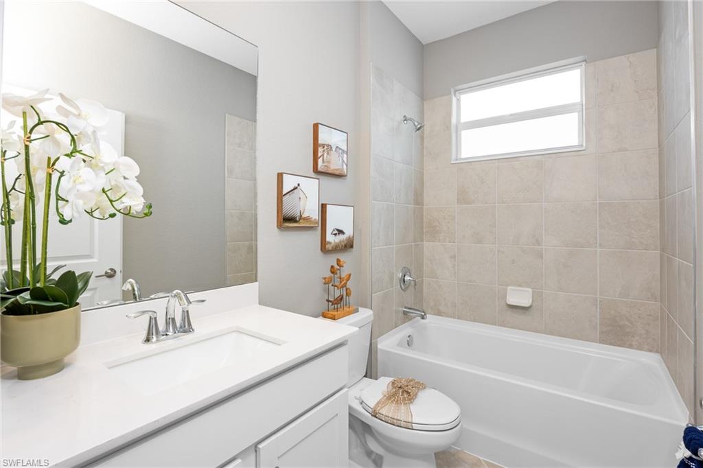 14888 Anchorage Road Punta Gorda, FL 33982 - Photo 13 of 34 Bathroom with vanity and washtub / shower combination