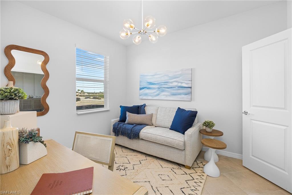14888 Anchorage Road Punta Gorda, FL 33982 - Photo 14 of 34 Living area featuring a chandelier and light tile patterned floors