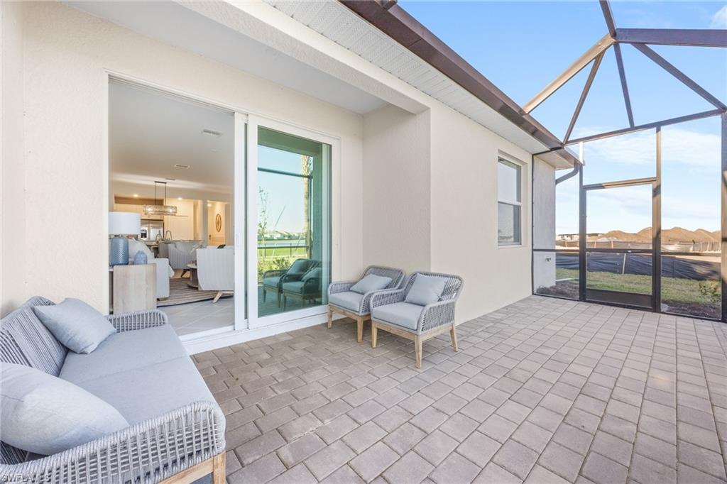 14888 Anchorage Road Punta Gorda, FL 33982 - Photo 22 of 34 View of patio featuring glass enclosure and outdoor lounge area