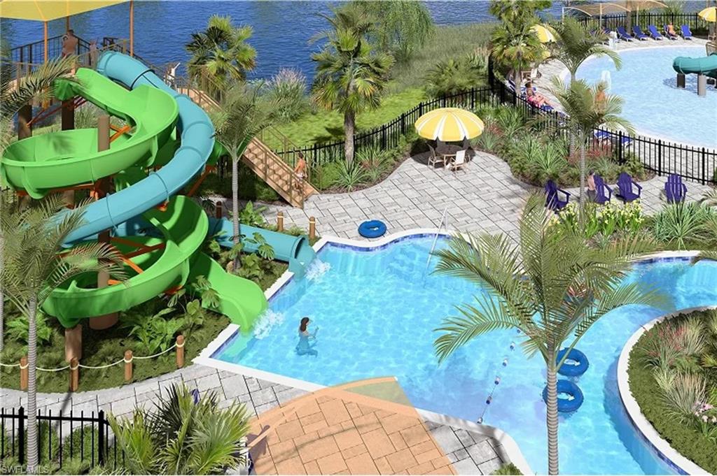 14888 Anchorage Road Punta Gorda, FL 33982 - Photo 26 of 34 Community pool featuring a water slide, a fenced backyard, and a patio area