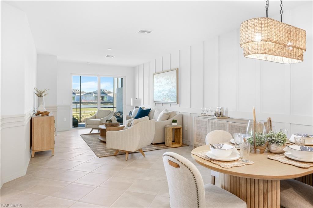 14888 Anchorage Road Punta Gorda, FL 33982 - Photo 5 of 34 Dining space featuring a decorative wall and light tile patterned flooring