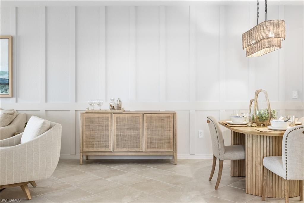 14888 Anchorage Road Punta Gorda, FL 33982 - Photo 7 of 34 Dining area featuring a decorative wall and light tile patterned flooring