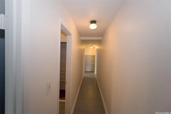 a view of a hallway with a white walls