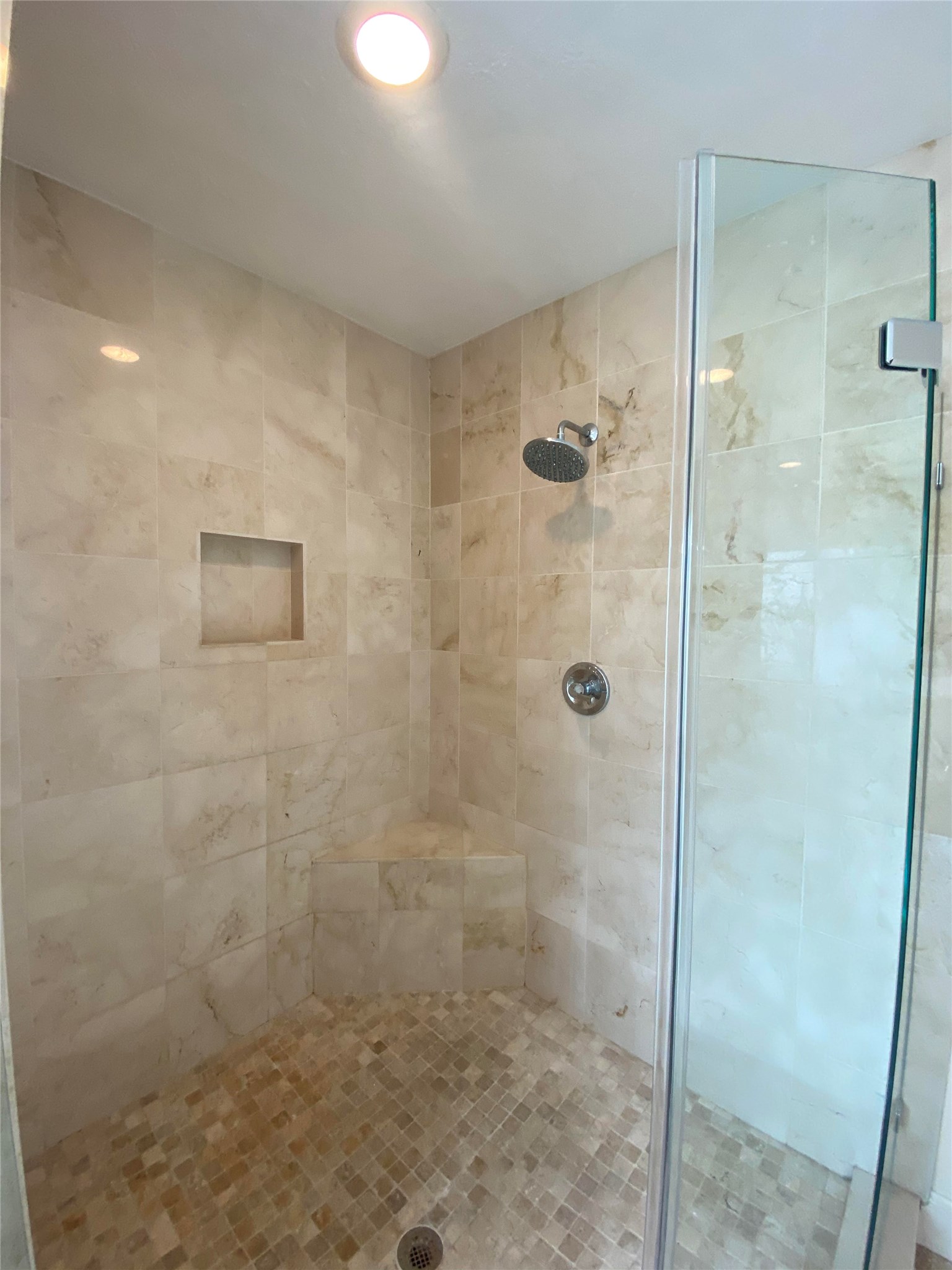 911 Hawthorne Road Clear Lake Shores, TX 77565 - Photo 21 of 50 AND WOW!!!!Over-Sized Travertine Frameless Shower With Rain Shower Head And Bench Seat