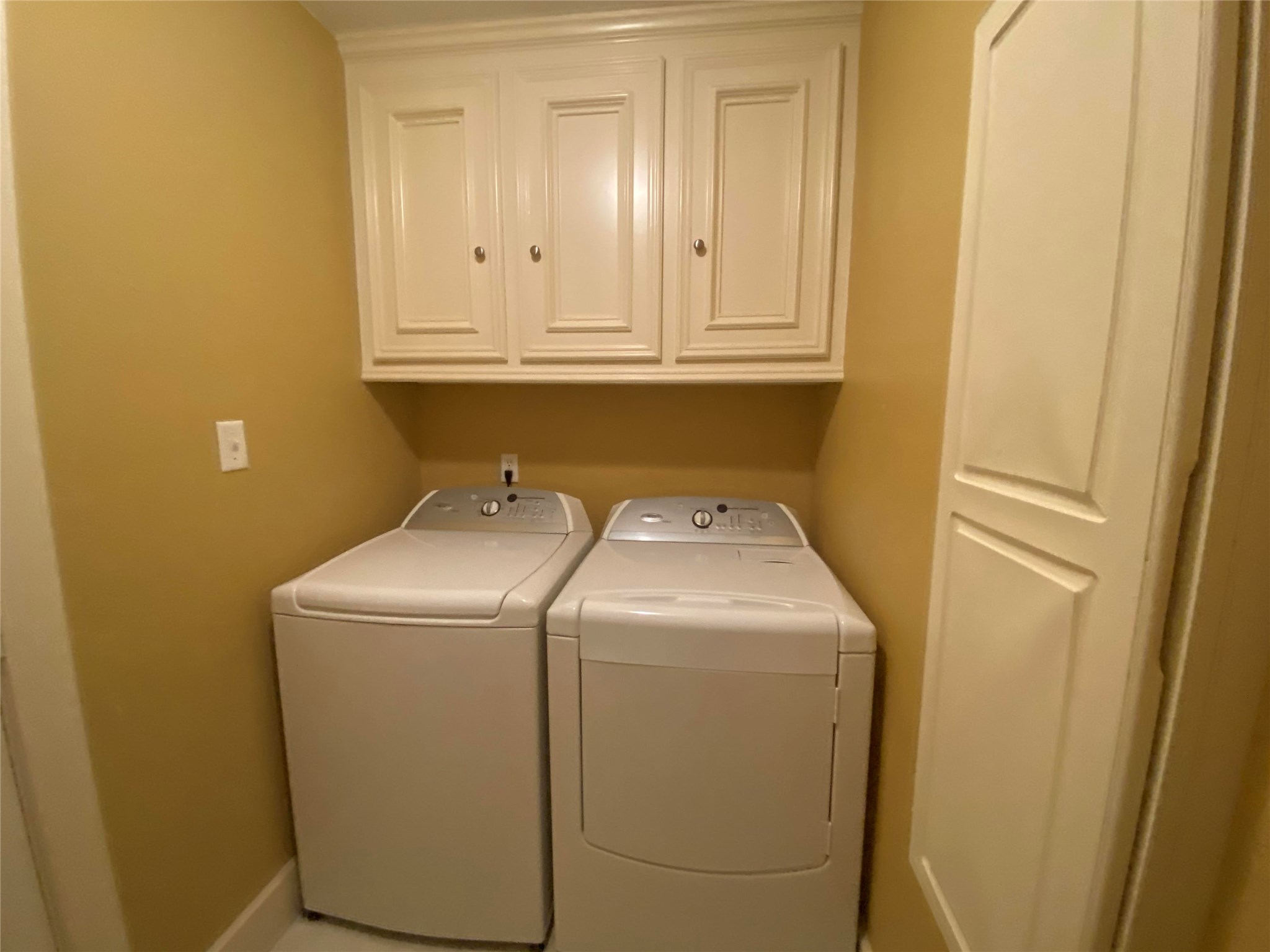 911 Hawthorne Road Clear Lake Shores, TX 77565 - Photo 23 of 50 Laundry Room On The First Floor And Cabinets Above