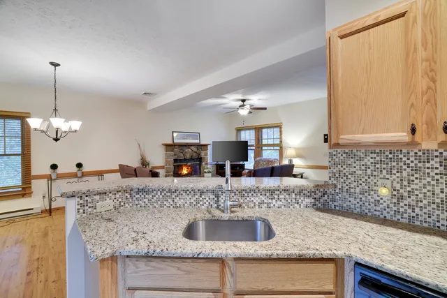 a kitchen with granite countertop a sink and a granite counter tops