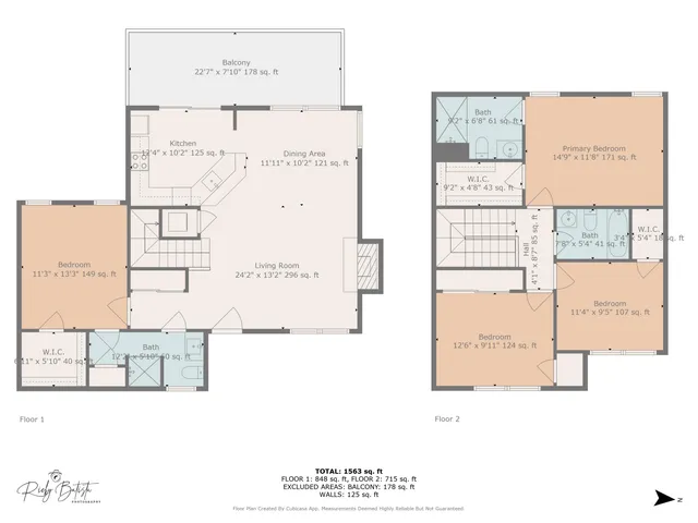 an aerial view of a house with a yard and outdoor seating