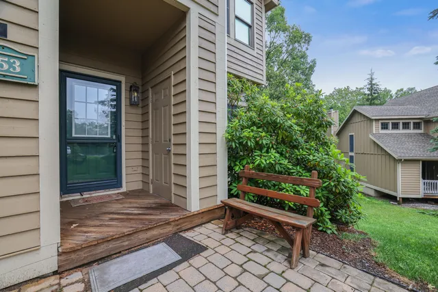 a view of a bench in the backyard