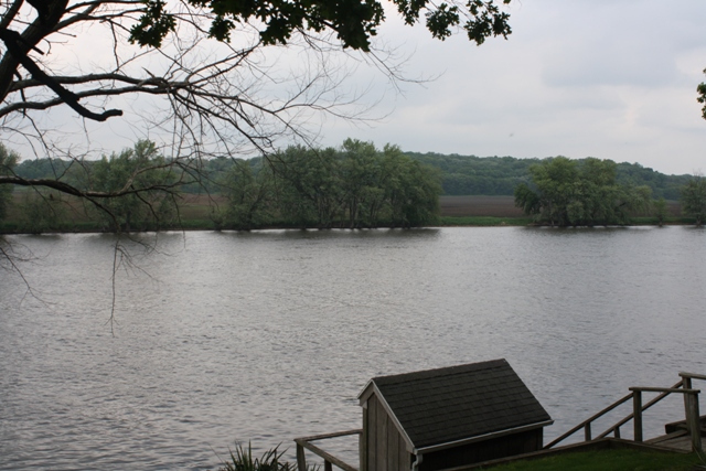 860 Riverside Drive Dixon, IL 61021 - Photo 12 of 13 a view of a lake with mountain in the background