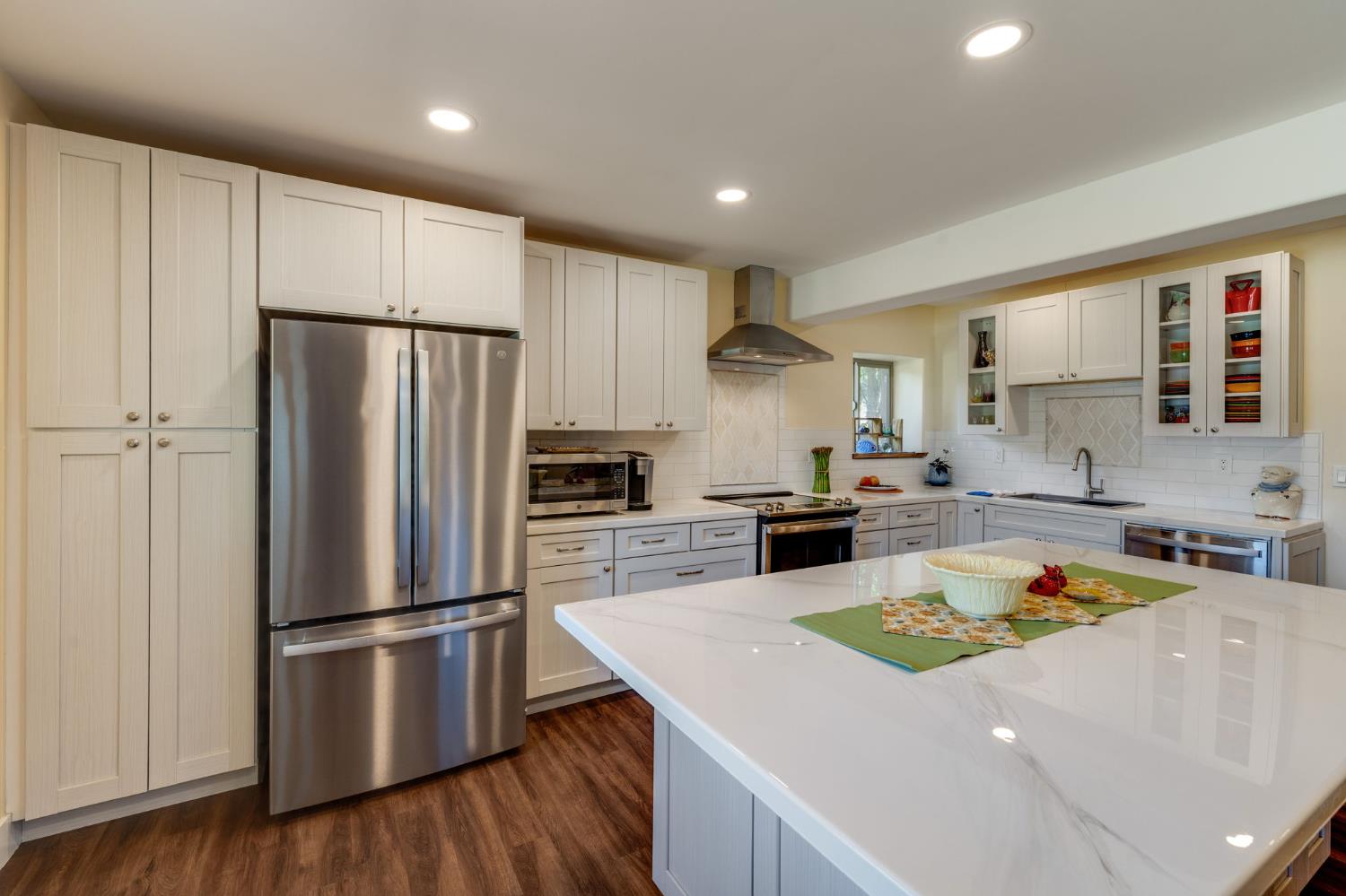 4600 El Caminito Road Shingle Springs, CA 95682 - Photo 40 of 76 a kitchen with a refrigerator a stove a sink and a oven with wooden floor