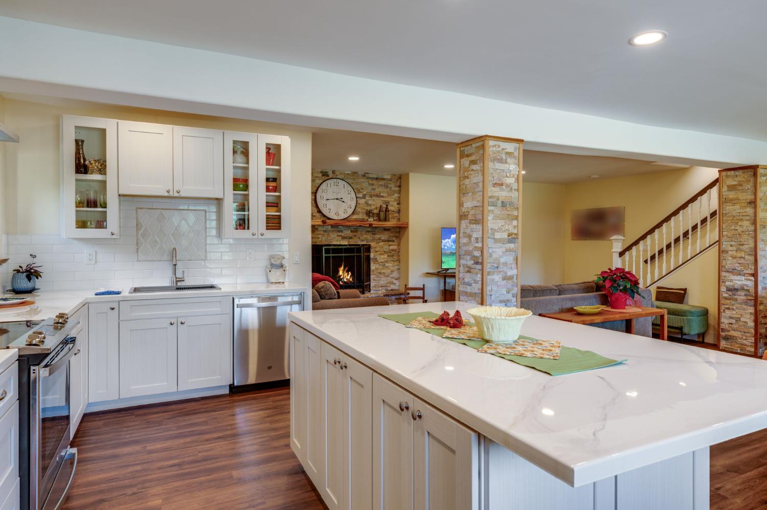 4600 El Caminito Road Shingle Springs, CA 95682 - Photo 42 of 76 a kitchen with a stove a sink and a refrigerator