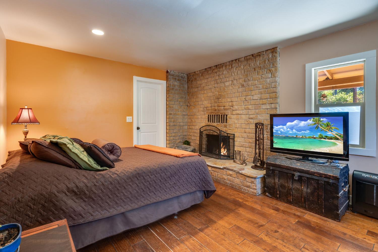 4600 El Caminito Road Shingle Springs, CA 95682 - Photo 46 of 76 a bedroom with a bed and a flat screen tv