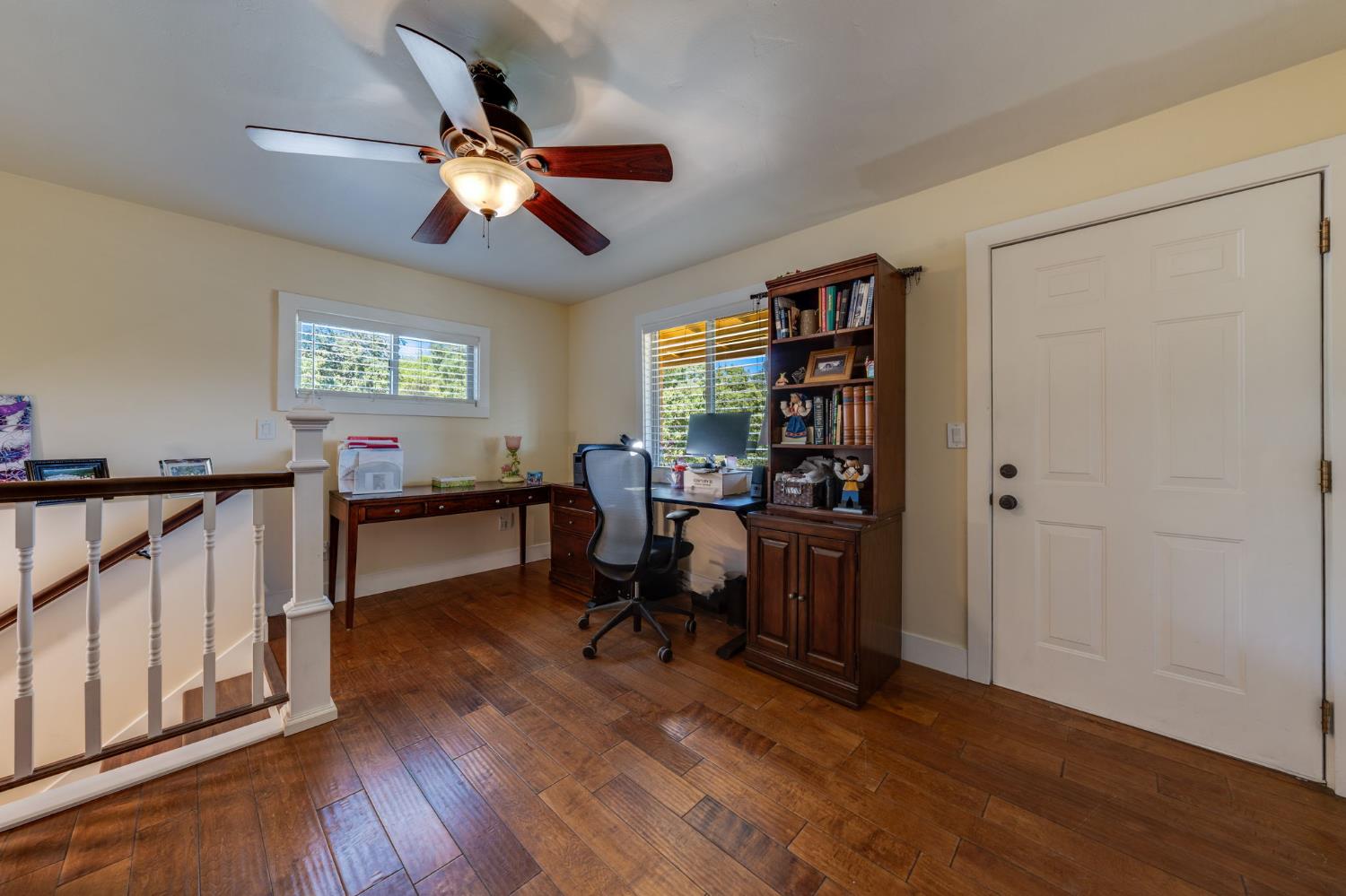 4600 El Caminito Road Shingle Springs, CA 95682 - Photo 53 of 76 a work room with wooden floor chandelier fan and windows