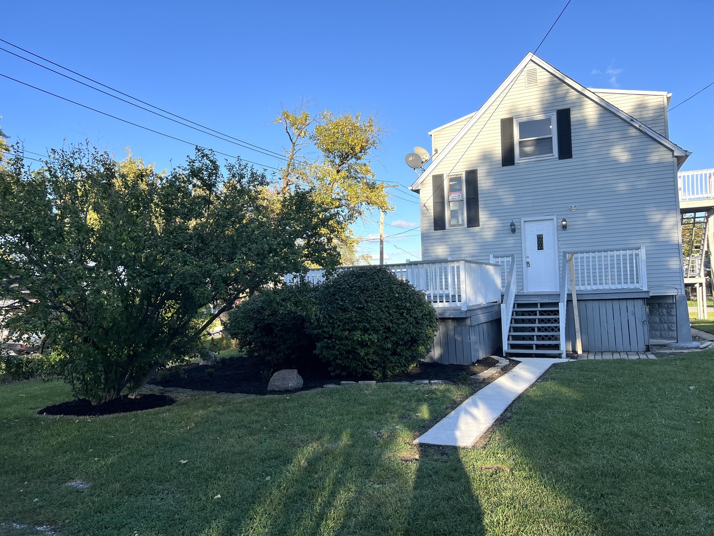 3002 Green Street Steger, IL 60475 - Photo 3 of 48 a front view of a house with a garden