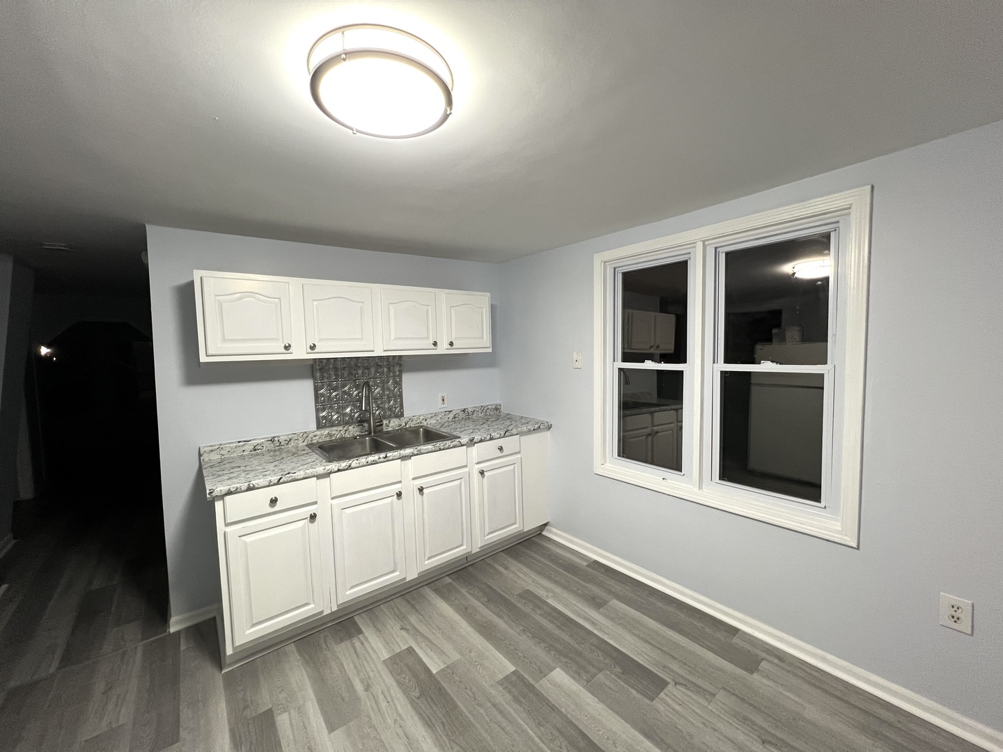 3002 Green Street Steger, IL 60475 - Photo 32 of 48 a large white kitchen with sink and cabinets