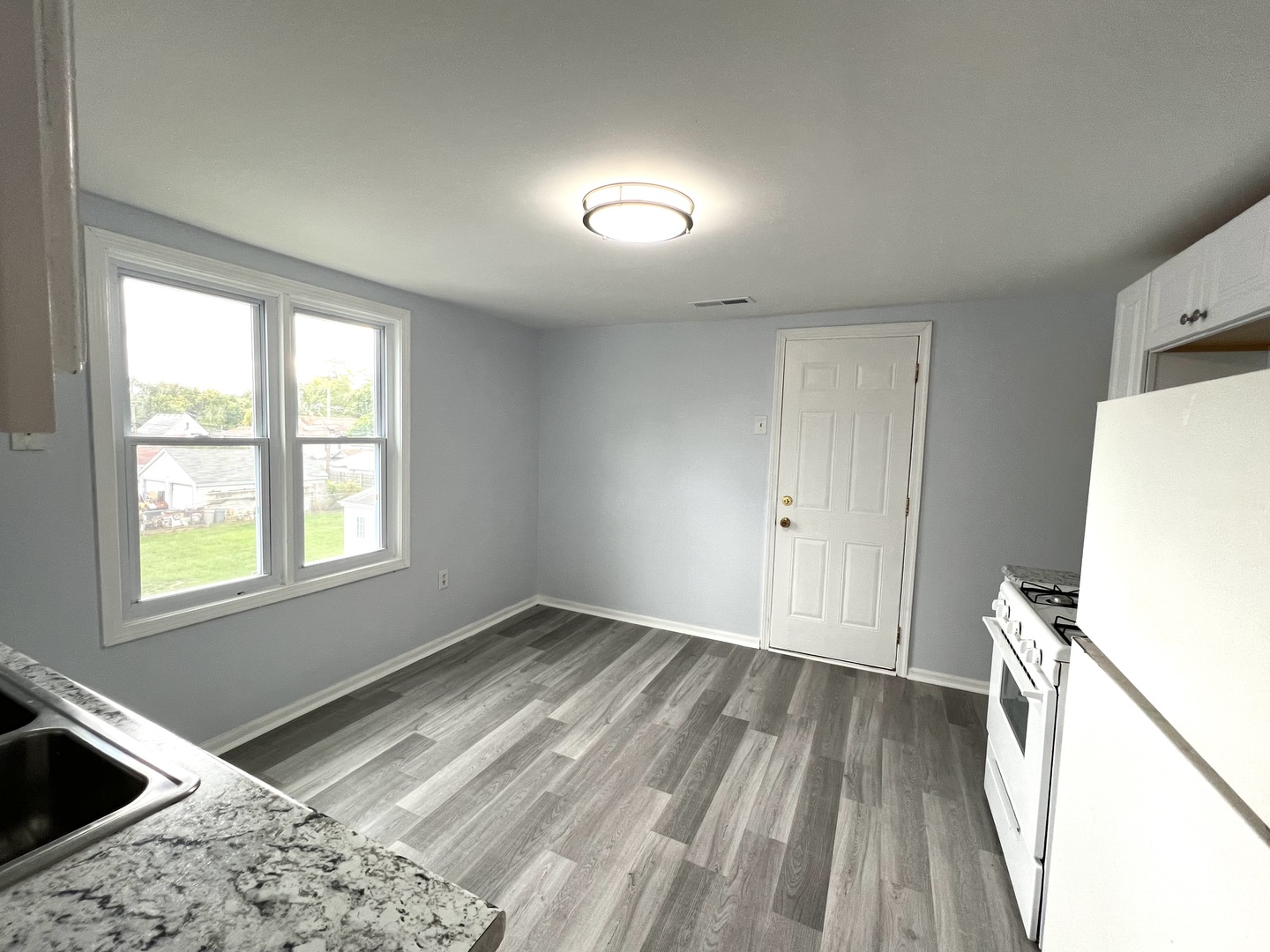 3002 Green Street Steger, IL 60475 - Photo 33 of 48 a view of a kitchen with wooden floor and a sink