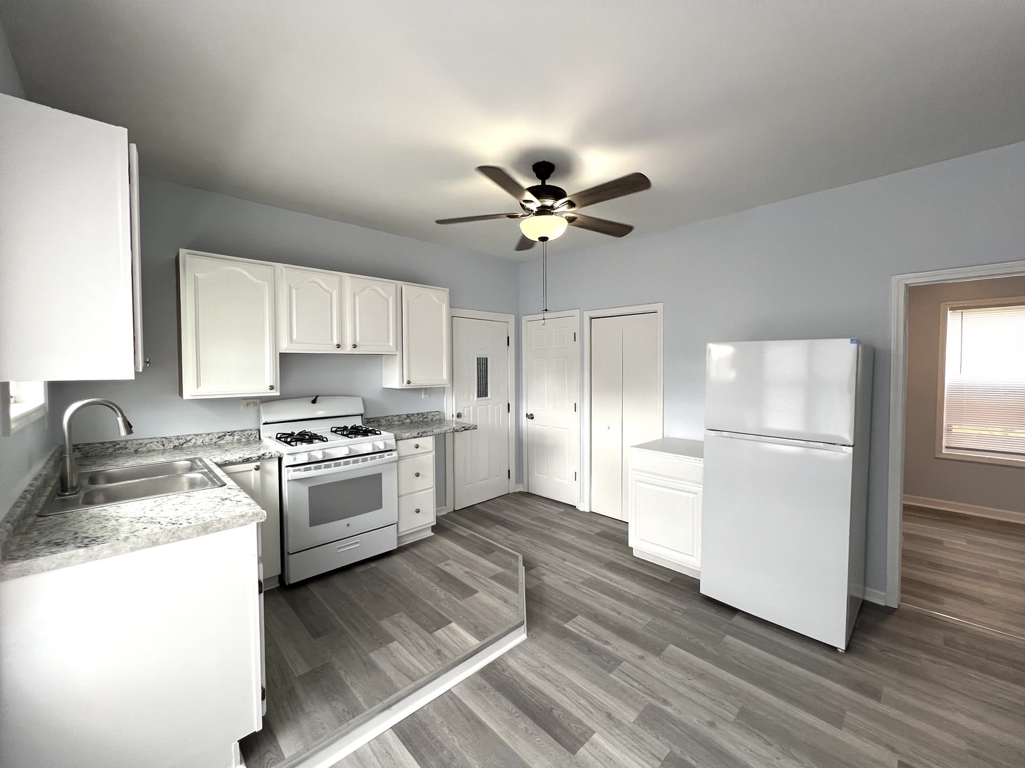 3002 Green Street Steger, IL 60475 - Photo 7 of 48 a kitchen with a refrigerator a stove a sink and a microwave