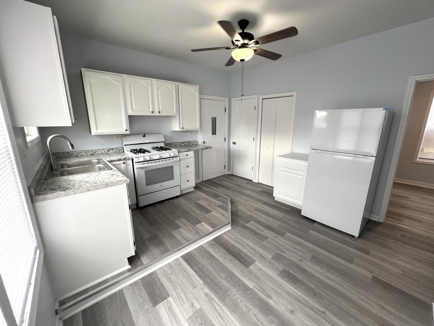 3002 Green Street Steger, IL 60475 - Photo 8 of 48 a kitchen with a refrigerator a sink and dishwasher