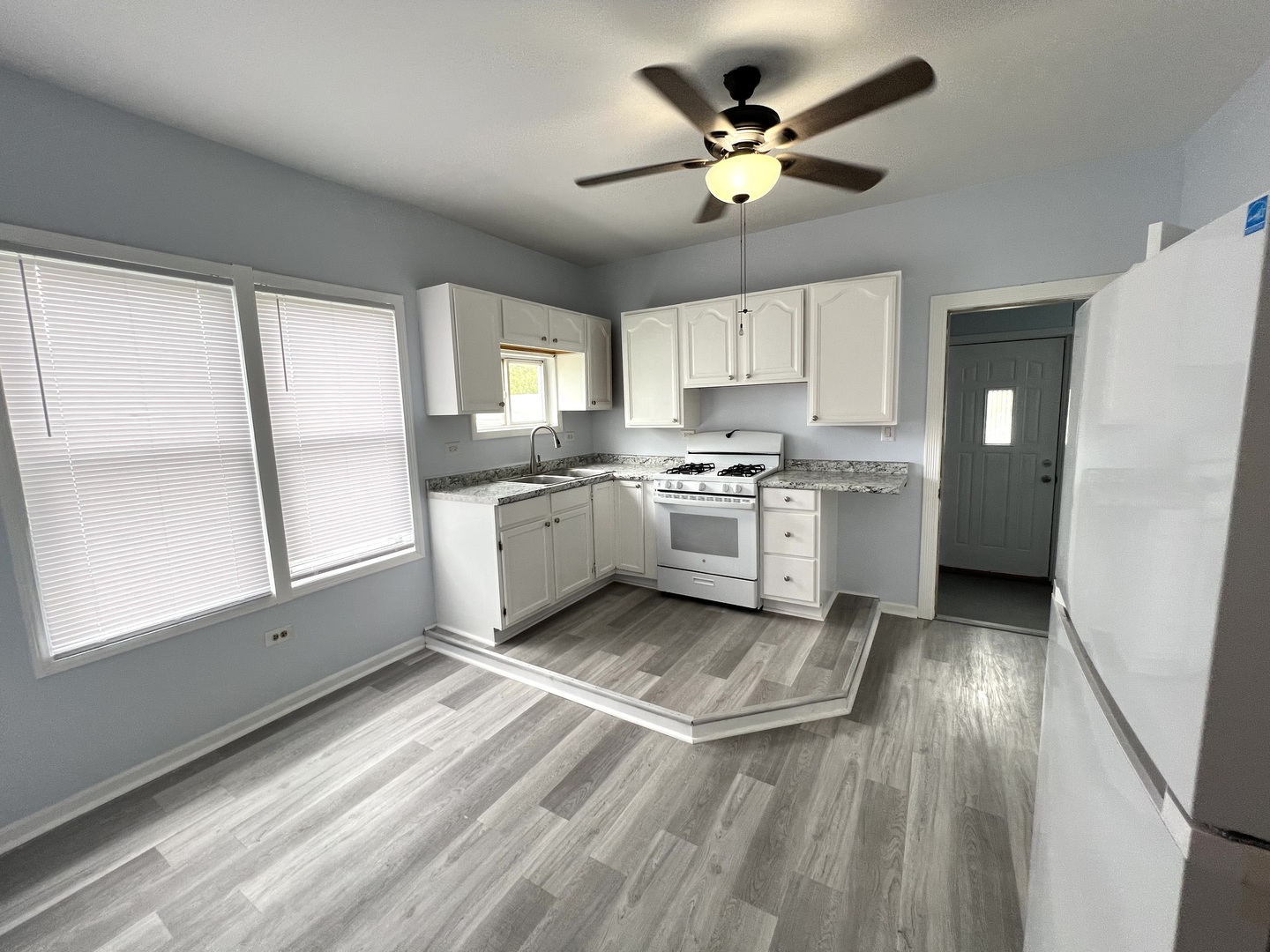 3002 Green Street Steger, IL 60475 - Photo 9 of 48 a kitchen with stove cabinets and wooden floor