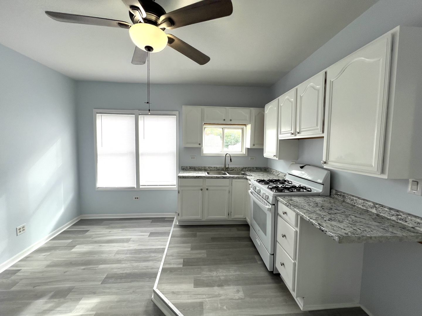 3002 Green Street Steger, IL 60475 - Photo 10 of 48 a kitchen with a stove a sink and a refrigerator