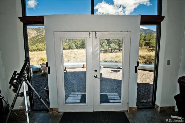 a view of an entryway with wooden floor