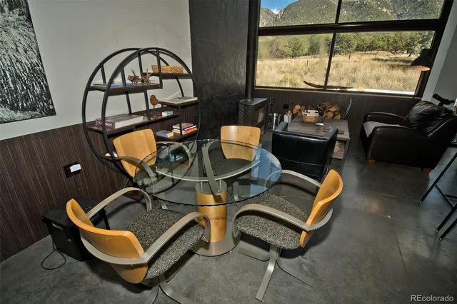 a living room with furniture a rug and a window