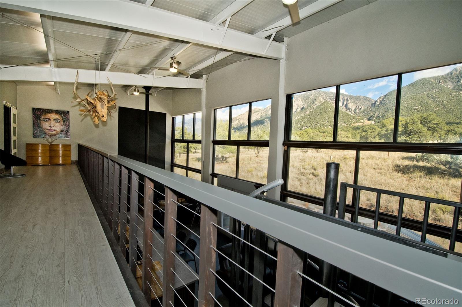 5 North Baca Grant Way Crestone, CO 81131 - Photo 23 of 42 a view of a porch with wooden floor
