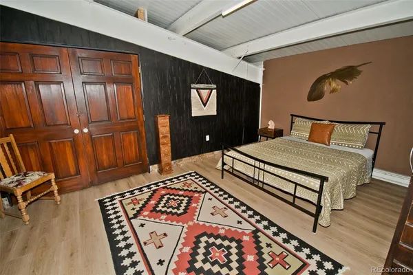 a bedroom with a bed and dresser