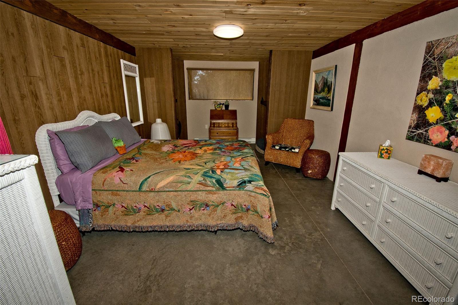 5 North Baca Grant Way Crestone, CO 81131 - Photo 33 of 42 a bedroom with a bed and a dresser
