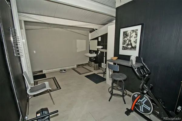 a bedroom with a bed and a desk