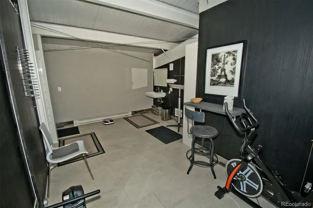 a bedroom with a bed and a desk