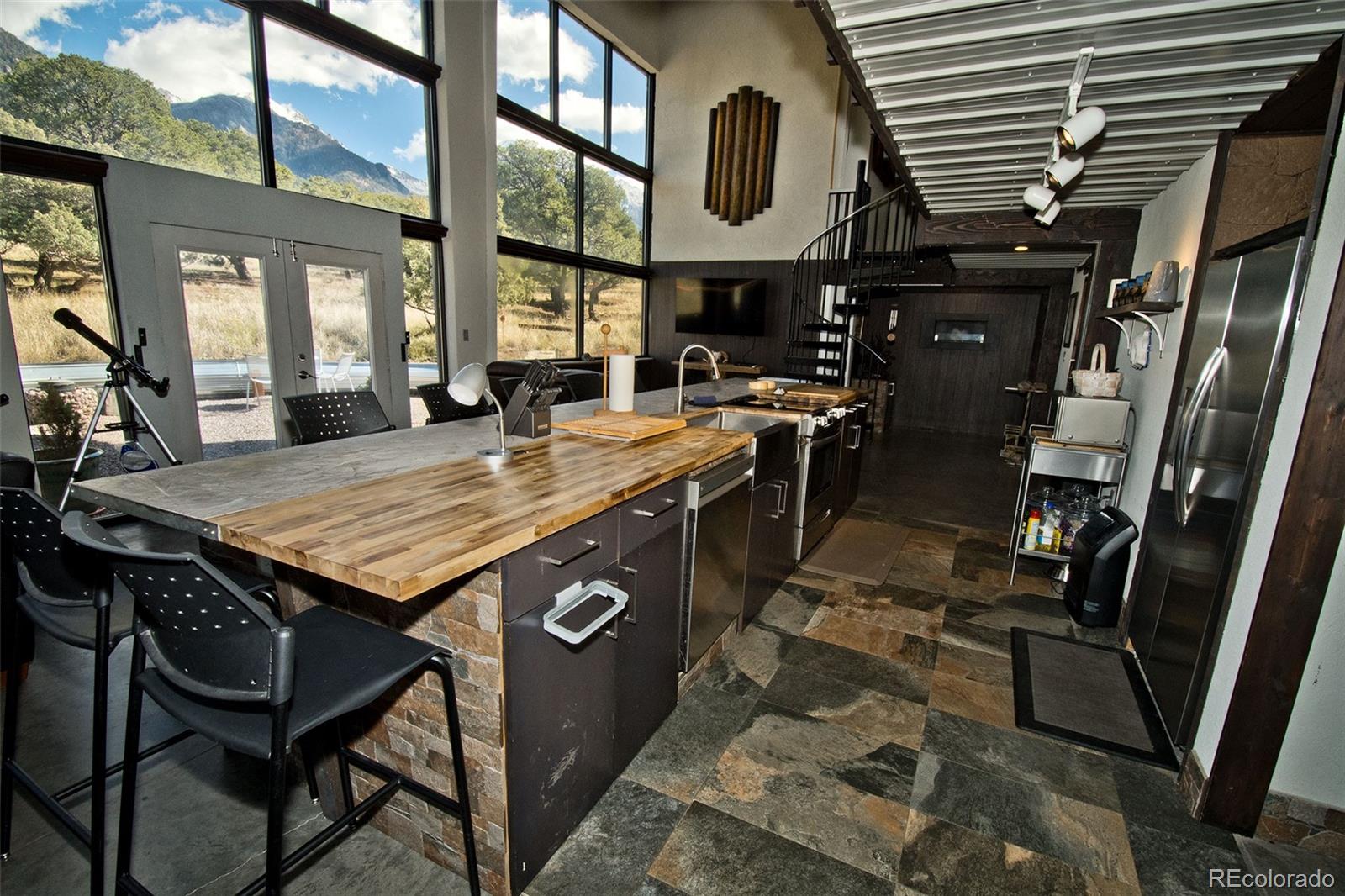 5 North Baca Grant Way Crestone, CO 81131 - Photo 6 of 42 a view of a dinning table and chairs in the patio