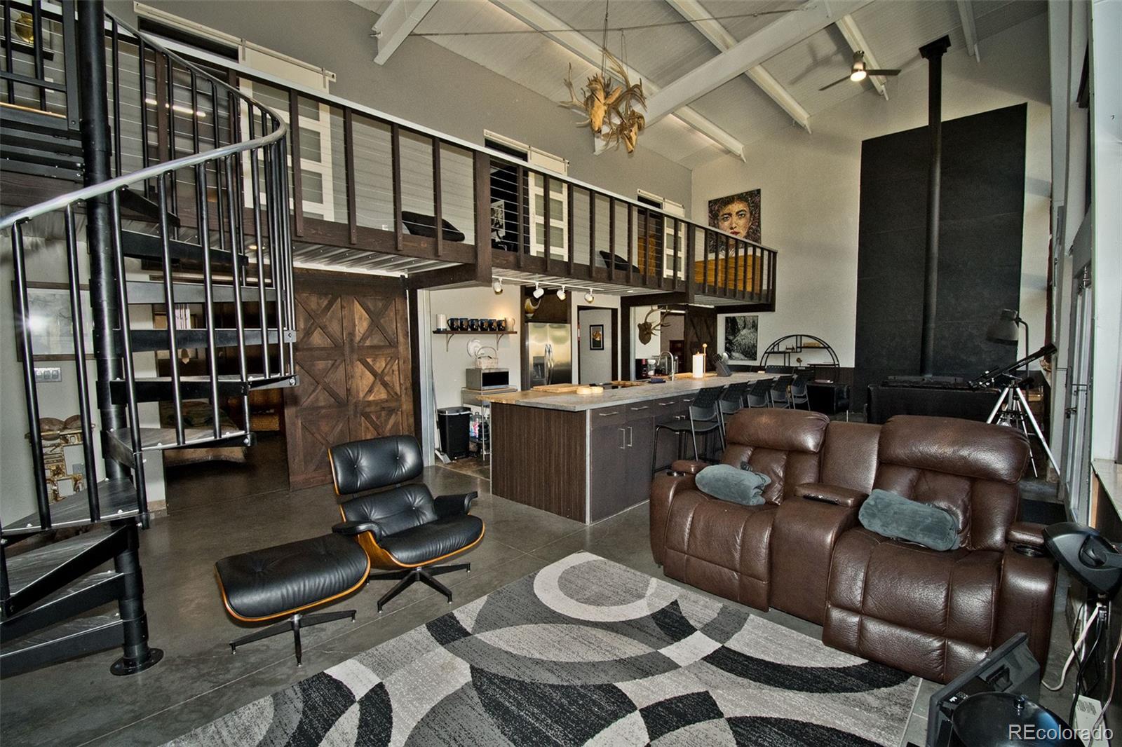 5 North Baca Grant Way Crestone, CO 81131 - Photo 9 of 42 a living room with furniture a window and gym equipment