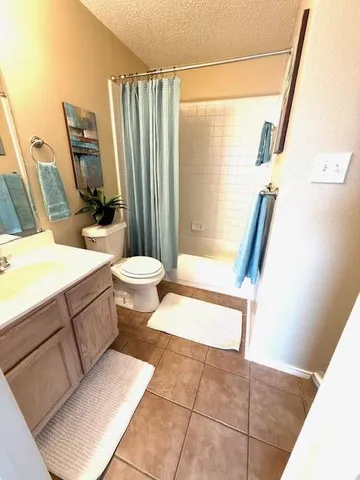 a bathroom with a sink a mirror and a toilet