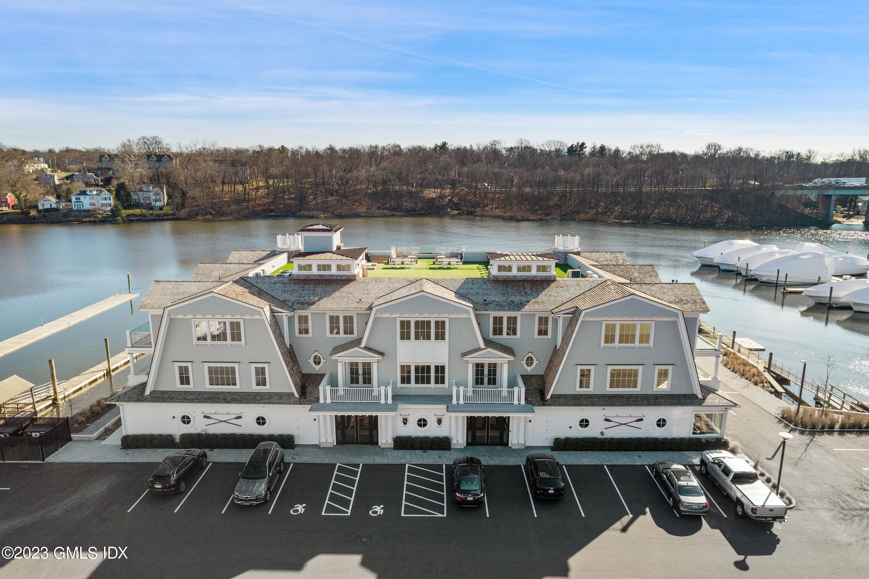 a view of a white building with a view of a lake