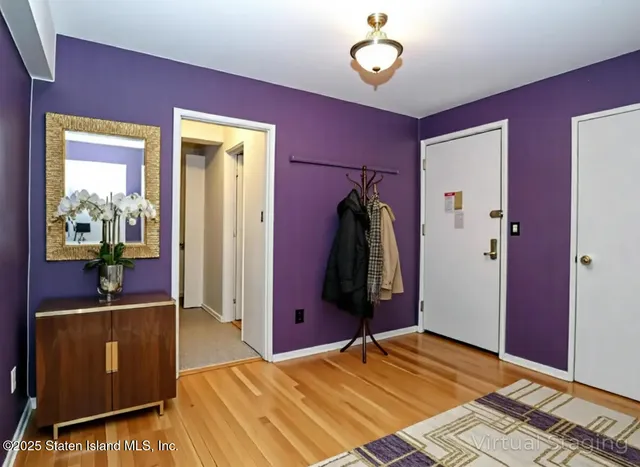 a bedroom with a bed and a television