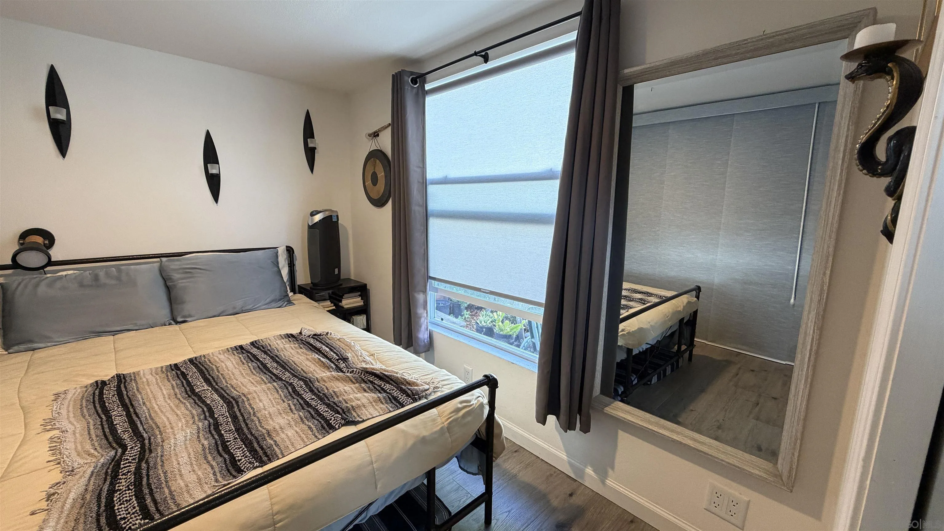 1549 North Vulcan Avenue, Unit 82 Encinitas, CA 92024 - Photo 17 of 32 a bedroom with a bed and a dresser next to a window