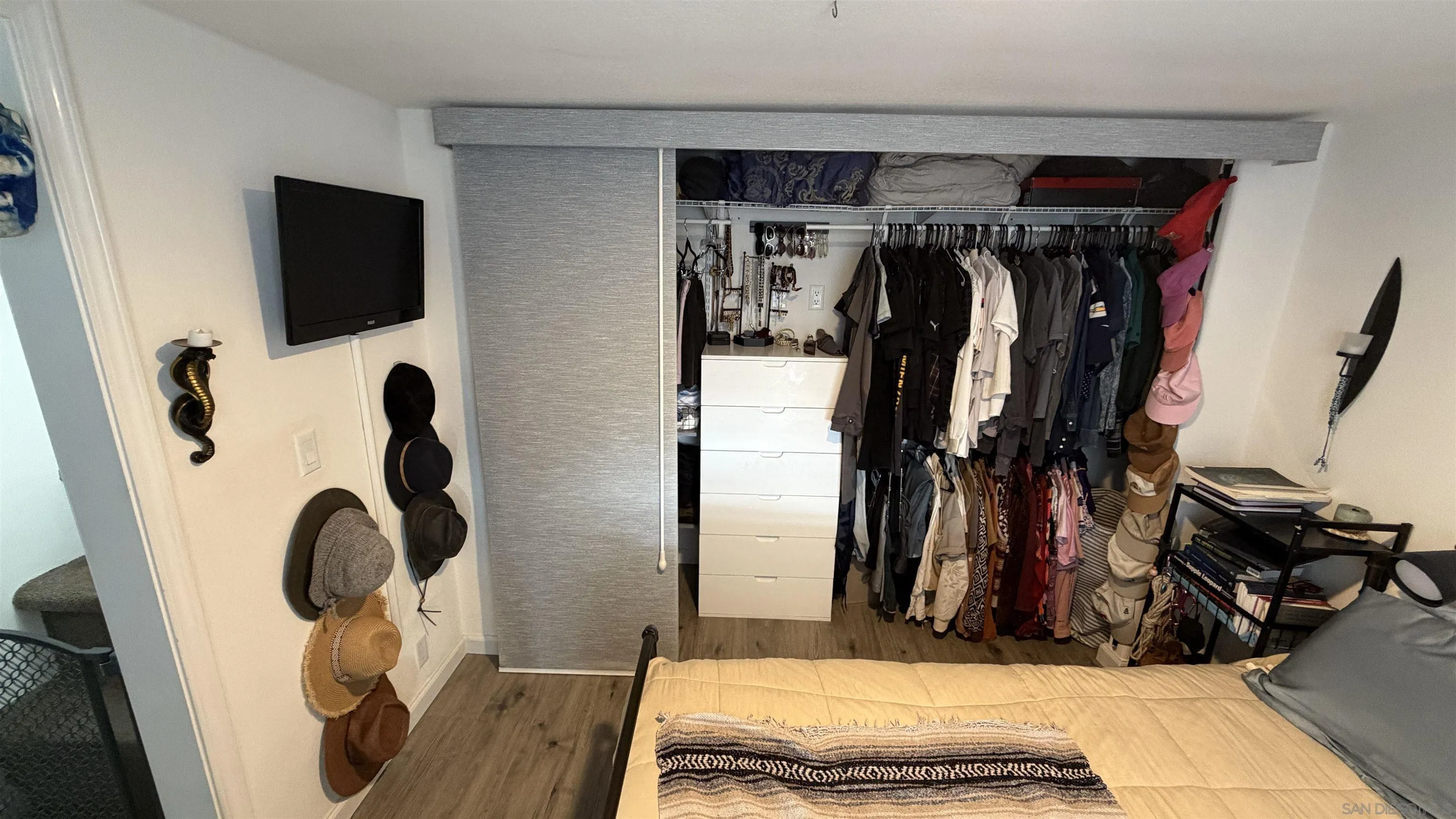 1549 North Vulcan Avenue, Unit 82 Encinitas, CA 92024 - Photo 18 of 32 a bed room with a bed and a mirror