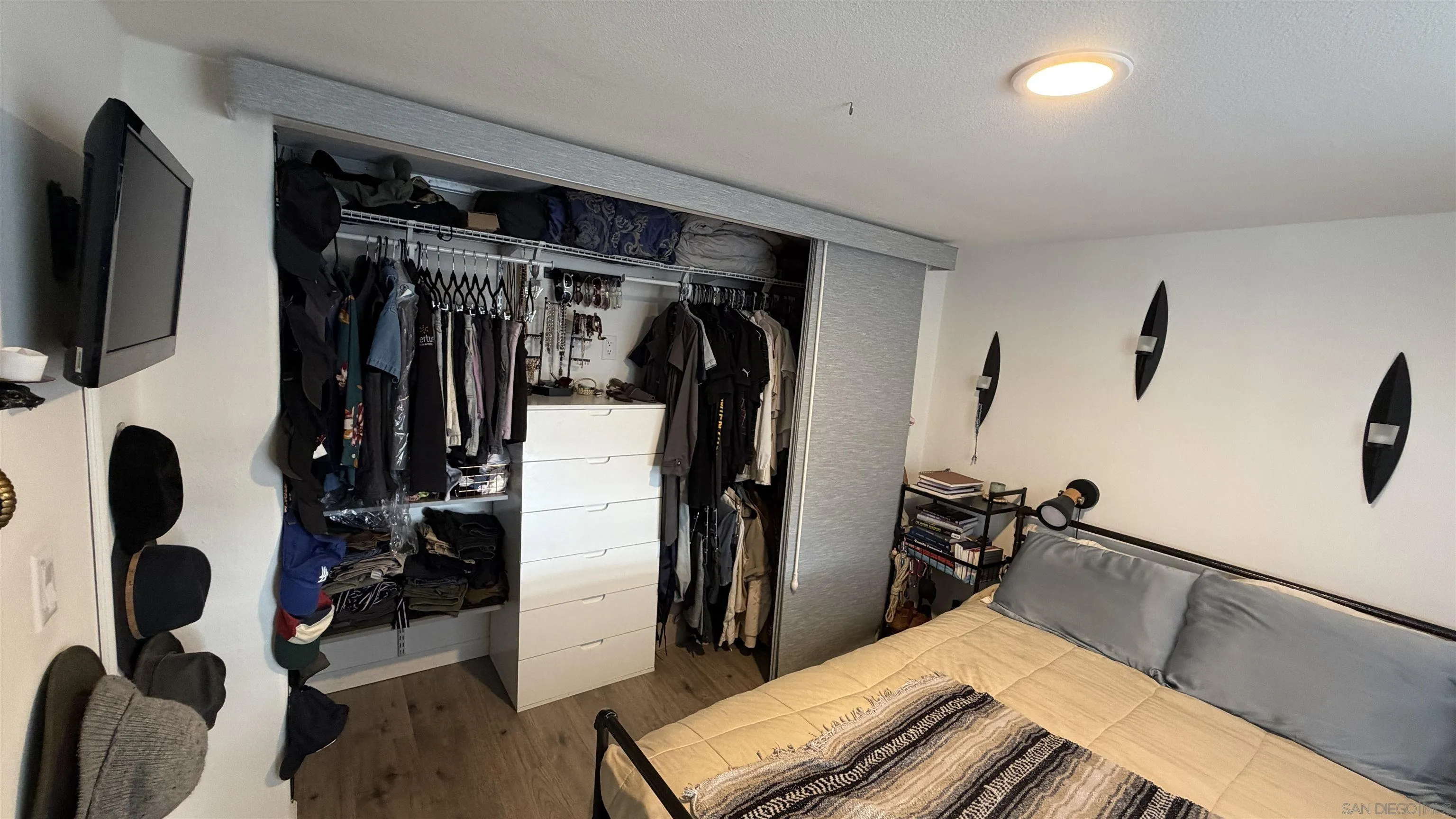 1549 North Vulcan Avenue, Unit 82 Encinitas, CA 92024 - Photo 19 of 32 a view of walk in closet with clothes and shoes